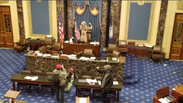 Capitol intruders in US Senate chamber, January 6, 2021