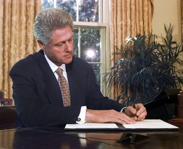 Clinton signs DOMA
